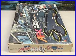 Aurora AFX Highway Pursuit Slot Car Set with Cars. 1980. Never Assembled