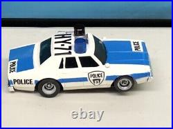 Aurora AFX Lited Rig Police ChaseSlot Car Set with Cars. Pre-owned