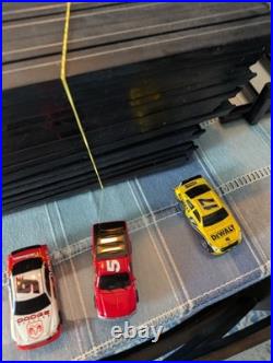 Champion speedway 600 race track set with 3 cars and extra tracks