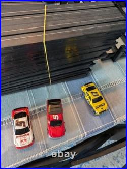 Champion speedway 600 race track set with 3 cars and extra tracks