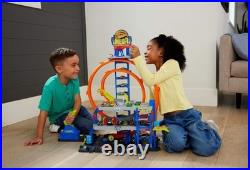 Explore the Hot Wheels Mega Loop Garage 164 Scale Cars & Helicopter Playset