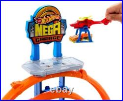 Explore the Hot Wheels Mega Loop Garage 164 Scale Cars & Helicopter Playset