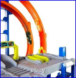 Explore the Hot Wheels Mega Loop Garage 164 Scale Cars & Helicopter Playset