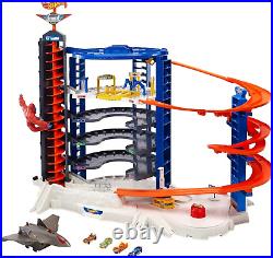 Hot Wheels Toy Car Track Set & 4 164 Scale Cars, Super Ultimate Garage, 3+ Ft