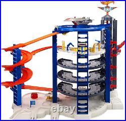 Hot Wheels Toy Car Track Set & 4 164 Scale Cars, Super Ultimate Garage, 3+ Ft