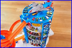 Hot Wheels Toy Car Track Set & 4 164 Scale Cars, Super Ultimate Garage, 3+ Ft