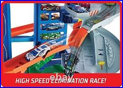 Hot Wheels Track Set and 2 Toy Cars Ultimate City Garage with Moving Dino Sto