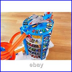 Hot Wheels Track Set with 4 164 Scale Toy Cars Over 3-Feet Tall Garage with M