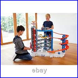 Hot Wheels Track Set with 4 164 Scale Toy Cars Over 3-Feet Tall Garage with M