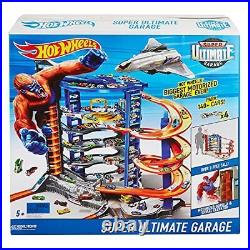 Hot Wheels Track Set with 4 164 Scale Toy Cars Over 3-Feet Tall Garage with M
