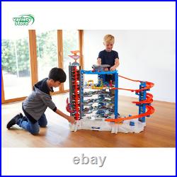 Hot Wheels Track Set with 4 164 Scale Toy Cars, Super Ultimate Garage, over 3-F