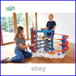 Hot Wheels Track Set with 4 164 Scale Toy Cars, Super Ultimate Garage, over 3-F