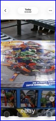 Hot Wheels Ultimate Garage Track Set with 2 Cars, T-Rex Dino