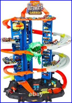 Hot Wheels Ultimate Garage Track Set with 2 Cars, T-Rex Dino 100+ Car Storage
