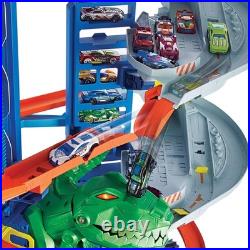 Hot Wheels Ultimate Garage Track Set with 2 Cars, T-Rex Dino 100+ Car Storage