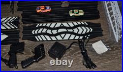 Lifelike Midnight Stunt Racers Glow-in-the-Dark HO Slot Car Race Track Set
