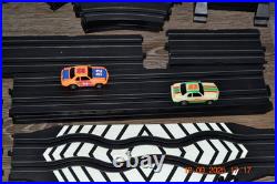 Lifelike Midnight Stunt Racers Glow-in-the-Dark HO Slot Car Race Track Set
