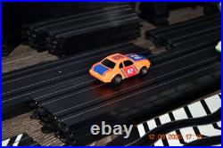 Lifelike Midnight Stunt Racers Glow-in-the-Dark HO Slot Car Race Track Set