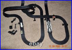 Lifelike Midnight Stunt Racers Glow-in-the-Dark HO Slot Car Race Track Set