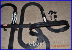 Lifelike Midnight Stunt Racers Glow-in-the-Dark HO Slot Car Race Track Set