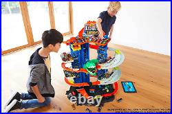 Track Set and 2 164 Scale Toy Cars, City Garage with Moving T-Rex Dino, Storage