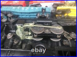 Vintage Lionel train set, including engines, cars, and lots of track Extras